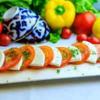 Brynza · Fresh Mozzarella with sliced tomatoes, garnished with fresh Dill and Extra Virgin Olive oil 