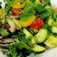 Avocado veggie salad  · Avocado, cherry tomatoes, cucumbers and red onions dressed with lemon juice, olive oil, vine...