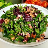 Roasted Beet Salad  · House roasted Beets, candied walnuts & Goat cheese on a bed of Arugula dressed with a Balsam...