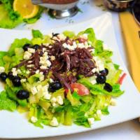 Greek · Hearts of Romaine, wedged steakhouse tomatoes, Feta, black olives, sliced cucumbers, fresh r...