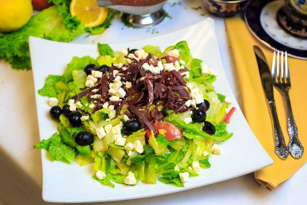 Greek · Hearts of Romaine, wedged steakhouse tomatoes, Feta, black olives, sliced cucumbers, fresh red peppers, Spanish onions, dressed with extra virgin Olive oil, vinegar, topped with Beef Pastrami 