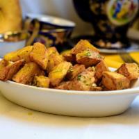 Home-Style Fried Potatoes · House made potatoes, flash fried and tossed in freshly minced garlic, dill, sea salt & black...