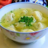 Pelmeni Soup · Decadent Russian dumplings filled with our signature lamb and beef blend swimming in a savor...