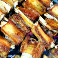 Lamb Ribs  · Domestic Texan lamb ribs marinated and seasoned   