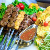Kebab Paradise · Eight skewers of different shish kebabs served with four Lamb chops and home-style potato ch...