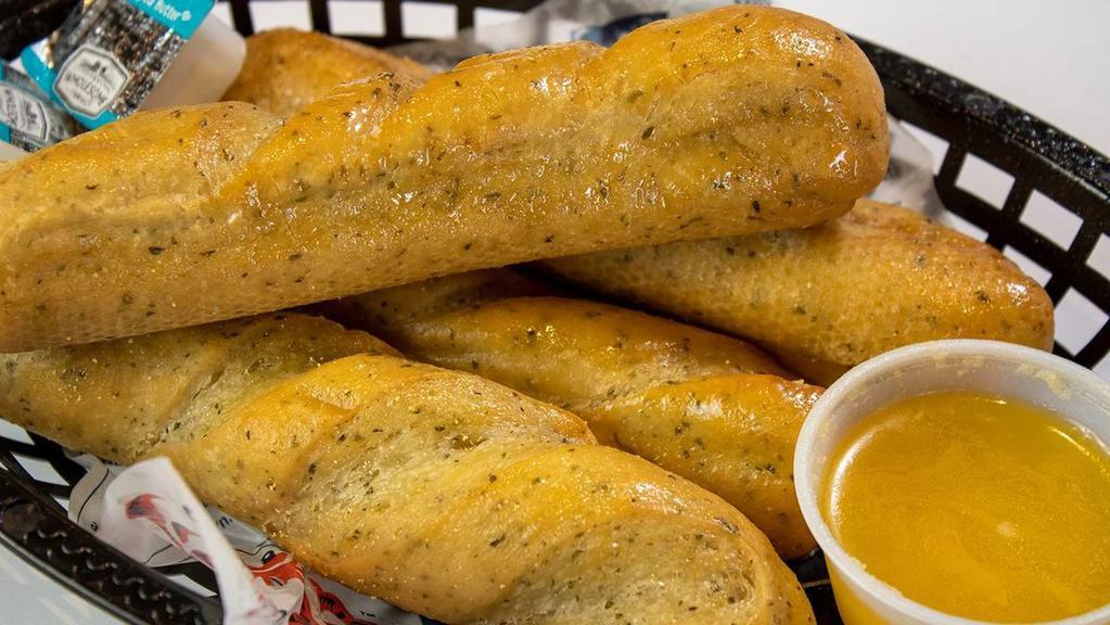 4 Piece Garlic Bread · Buttery bread that is topped with garlic.