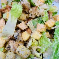 Caesar Chicken Return Salad · Romaine lettuce croutons topped with parmesan cheese and caesar dressing.