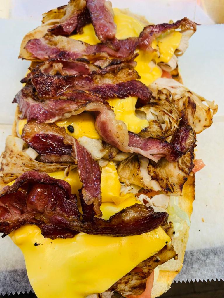 Turkey Club Sandwich · Turkey, American cheese, bacon. lettuce, tomato and mayo.