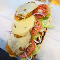 Chicken Cutlet Sandwich · Breaded chicken cutlet with cheese, lettuce and tomatoes.