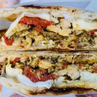 The Italiano Panini · Grilled chicken, roasted peppers, fresh mozzarella and pesto sauce.