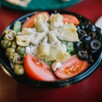 Greek Salad · Greens, artichoke, black and green olives, tomato, feta, balsamic vinaigrette.