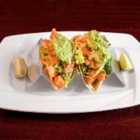 Baja Style Fish Tacos · Corn tortilla, chipotle aioli, lettuce, pico de gallo and guacamole.