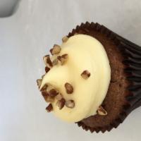 Carrot · Carrot cupcake with a extra dash of cinnamon with pecans and coconut. 