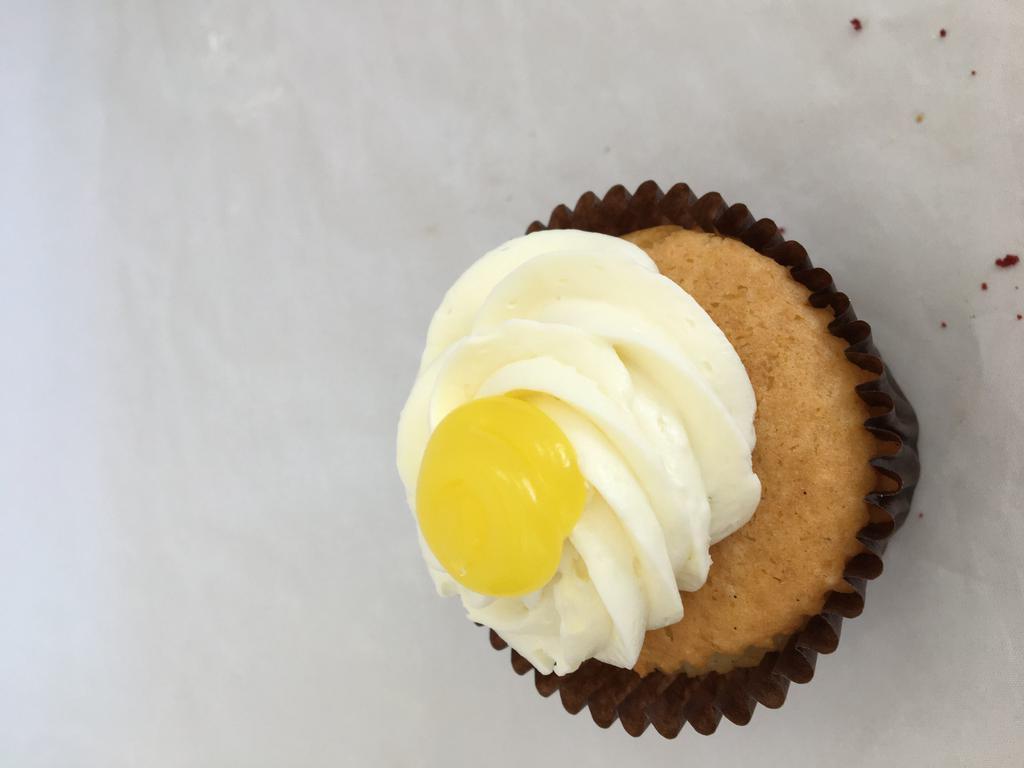 Lemon Drop · Vanilla cupcake filled with lemon curd frosted lemon buttercream.