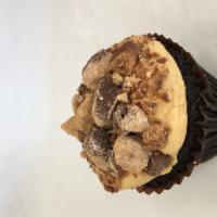 Peanut Butter Cup · Chocolate cupcake frosted with peanut butter cream cheese dipped in Reese’s peanut butter cu...