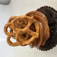 Caramel Crunch  · Chocolate cupcake frosted with salted caramel topped with pretzels.