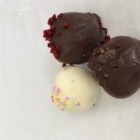 Cake Balls  · Assorted flavors- cake mixed with frosting dipped in dark or white chocolate. ( 4 pack)