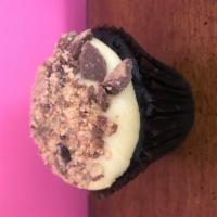 Peanut Butter Cup Cupcake · Chocolate cake topped with peanut butter-cream cheese frosting and peanut butter cup crumbles 