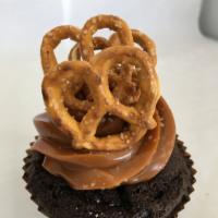 Caramel Crunch Cupcake · Chocolate cake topped with caramel frosting, sea salt, and pretzels.