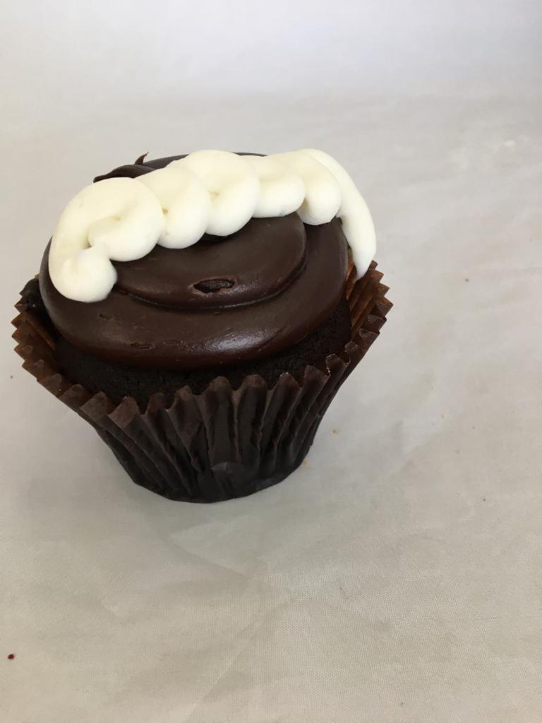 Chocolate Cream Cupcake · Buttercream-filled chocolate cake topped with fudge frosting.