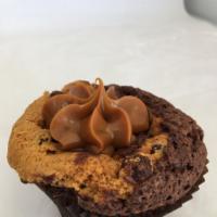 Brookie · A fudgy brownie with a cookie baked in topped with fudge or caramel.