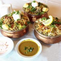 Dum Biryani Vegetables · Different layers with fried onions, fresh cilantro and mint cooked in traditional dum puhkt ...