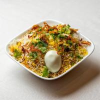 Dum Biryani Chicken · Different layers with fried onions, fresh cilantro and mint cooked in traditional dum puhkt ...