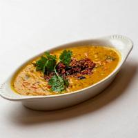 Dal Tadka · Yellow split peas sauteed with onions, garlic, tomatoes and spices.
