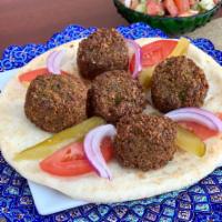 Falafel · Served with freshly baked bread. Chickpeas, garlic, and spice.
