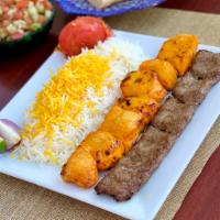 Bakhtiari Kabob · Served with a choice of salad or basmati rice with saffron. One skewer of beef and one skewe...