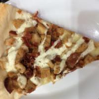 Chicken Bacon Ranch Pizza Slice · Savory pie with a dough base topped with sauce and cheese.
