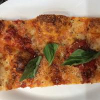 Grandma Sicilian Pizza Slice · Savory pie with a dough base topped with sauce and cheese.