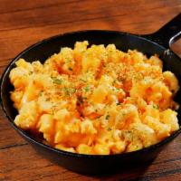 Truffle Mac and Cheese · Macaroni prepared with freshly made cheese sauce, beurre noisette, bread crumbs and white tr...