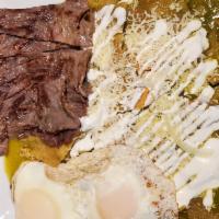 Chilaquiles Con 2 Huevos Y Carne · Two eggs with green or red chilaquiles.