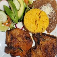 Chuleta Frita · Fried pork chops. Accompanied with rice and beans or french fries with salad or sweet planta...