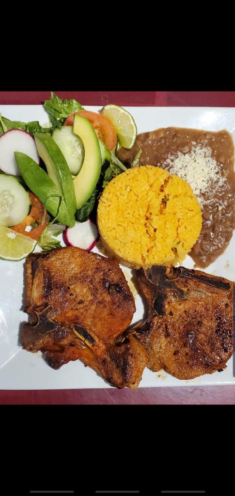 Chuleta Frita · Fried pork chops. Accompanied with rice and beans or french fries with salad or sweet plantains.