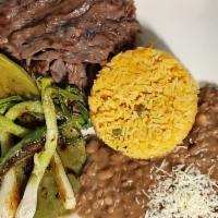 Plato de Cecina · Sauteed steak with guacamole. Accompanied with rice and beans or french fries with salad or ...