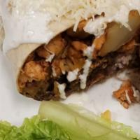 Burrito · Burrito with rice and black beans toped with white cream and white cheese
