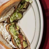 Torta De Milanesa De Pollo · Breaded chicken sandwich. Served with beans, lettuce, tomatoes, jalapenos, avocado and mayon...