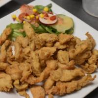 Fried Boneless Chicken Combo (Chic Sin Hueso Combo) · A large plate of crispy boneless chicken strips with Tostones, salad, white rice,  red beans...