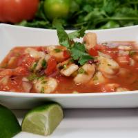 Ceviche · Shrimp marinated in chopped red & white onions, cilantro, peppers, tomato and fresh lime jui...