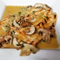 Chicken in Mushroom Sauce (Pechuga en Hongos) · A juicy grilled breast topped with a fresh and flavorful portobello mushroom sauce.