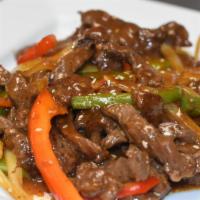 Beef Teriyaki (Bistec Teriyaki) · Sauteed Sirloin strips with onions, red and green peppers in a delicious teriyaki sauce.