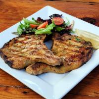 Grilled Pork Chops (Chuleta a la Parrilla) · A pair of pork chops slowly grilled with a splash of fresh lime. Served with your choice of ...