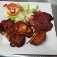 Fried Pork Chops (Chuleta Frita) · Two juicy and tenderly fried lemon flavored pork chops. Served with your choice of side. 