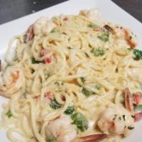 Shrimp Alfredo Pasta · Lime cured shrimps in a freshly made Fettuccine Alfredo pasta topped with Parmesan cheese.
