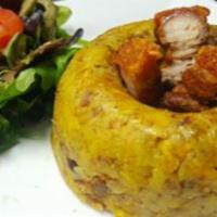 Mofongo · Fried, then mashed plantains with a touch of seasoned garlic with your choice of filling. 
