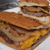 Steak and Onion Sandwich (Sandwich de Bistec) · Juicy and flavorful strips of sirloin steak sauteed in caramelized onions served on 
an Ital...