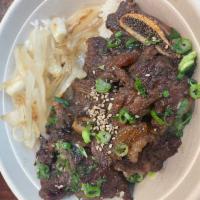Prime LA Galbi - Beef Short Ribs (Korean BBQ) · Special soy sauce marinated. (With Sautee onion)