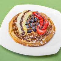 1. Vanilla Wafffle  · Home-made vanilla waffle, served with banana, strawberries and choice of honey, Nutella, Bel...